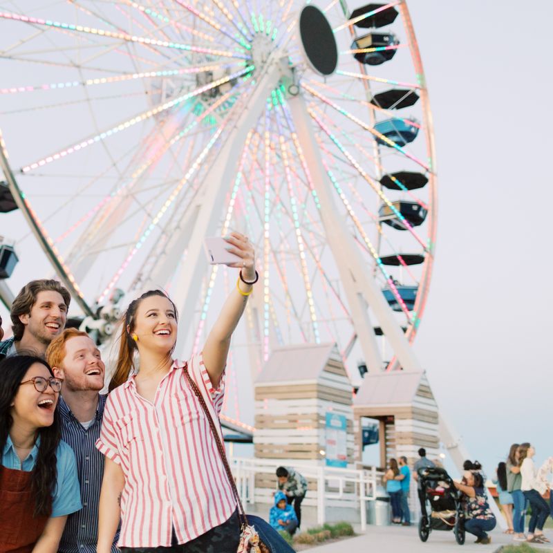 OC students taking a selfie in front of the Wheeler Ferris Wheel