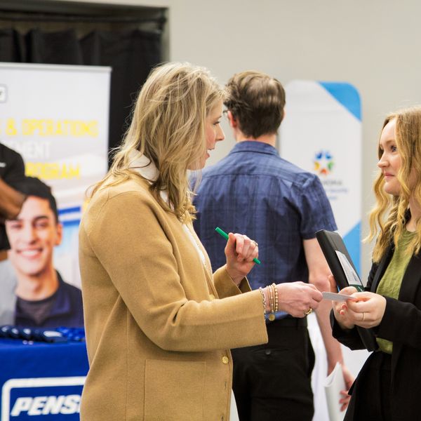 People talking at a career fair