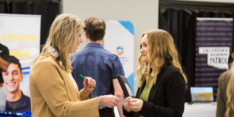 People talking at a career fair