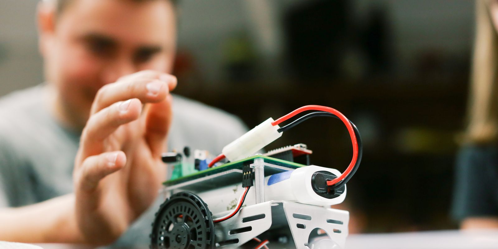 Electrical Engineering student with car