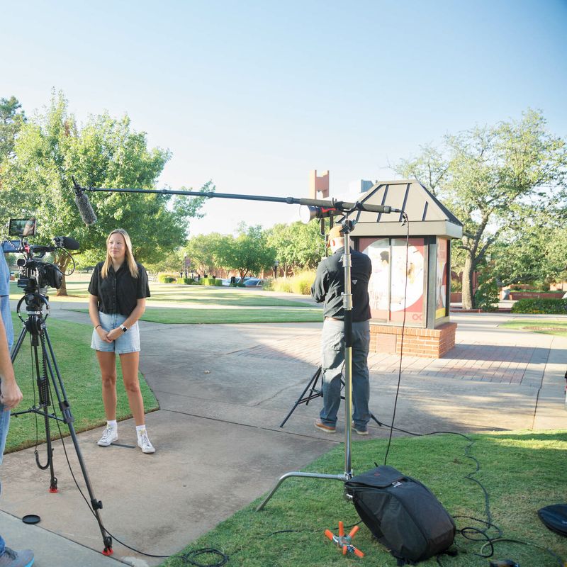 OC Student being filmed for the news