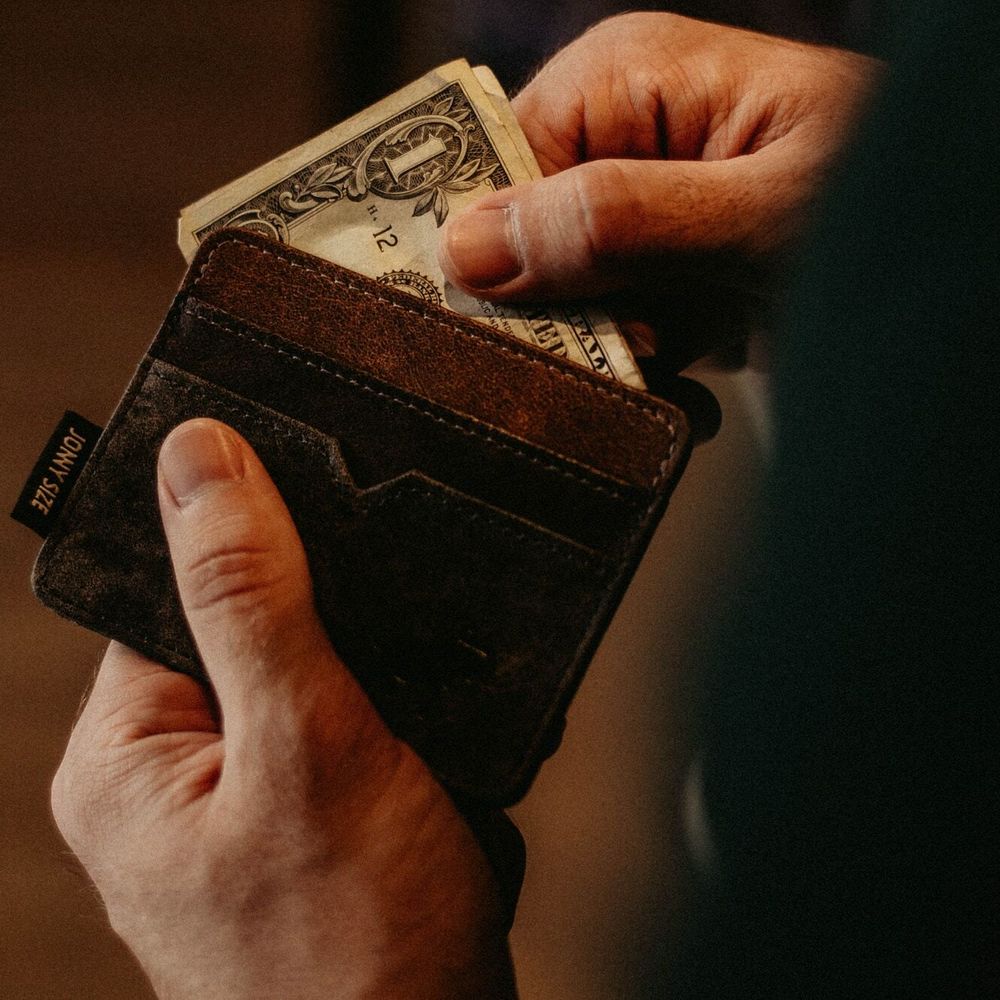 Money being pulled from wallet