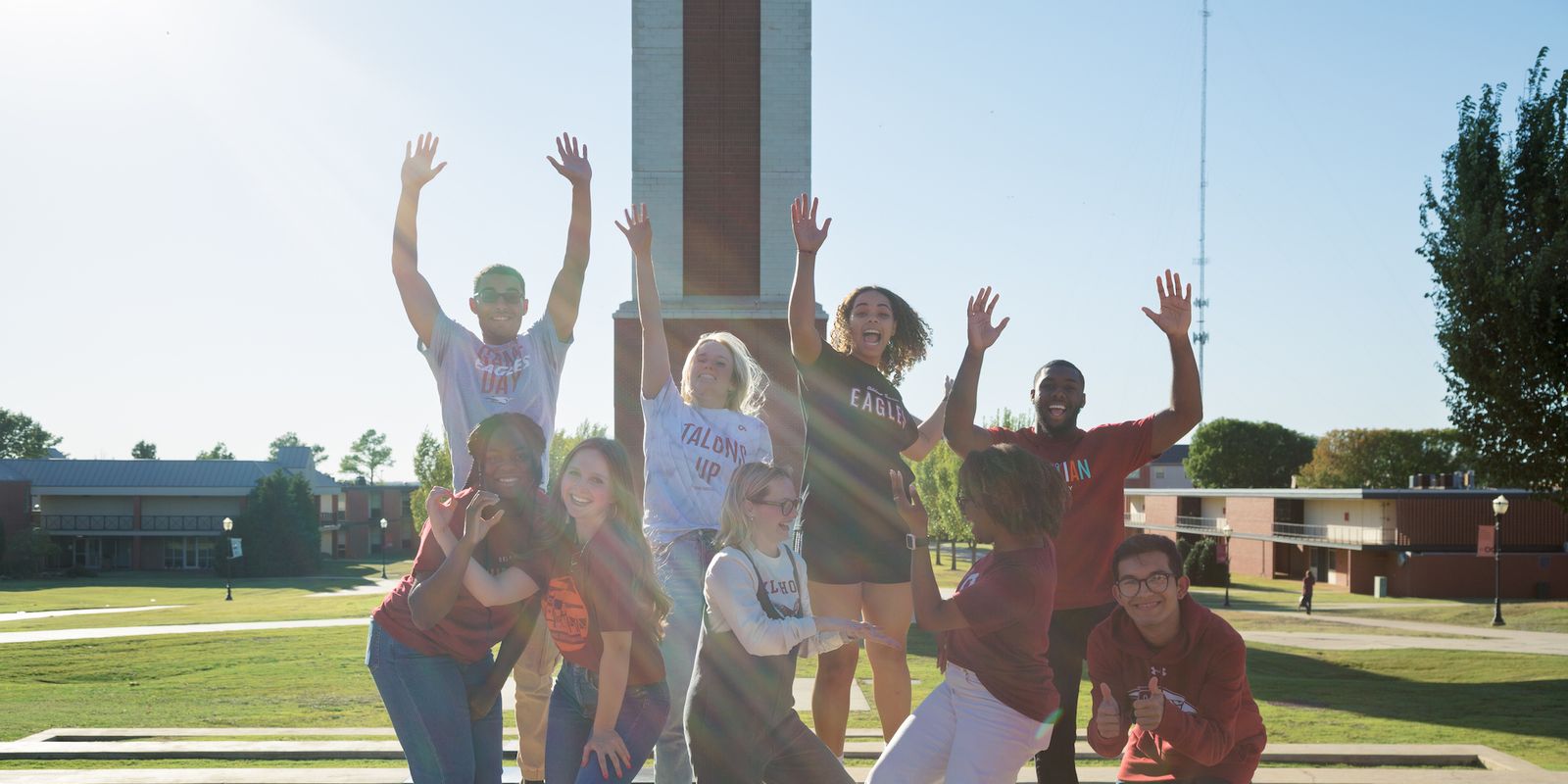 Jumping Students in Front of Clock Tower