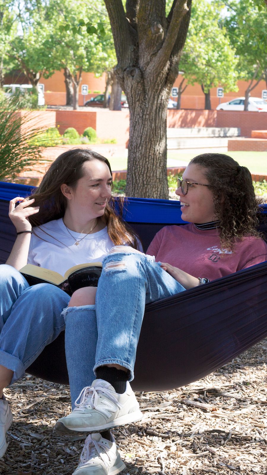 friends talking in a hammock