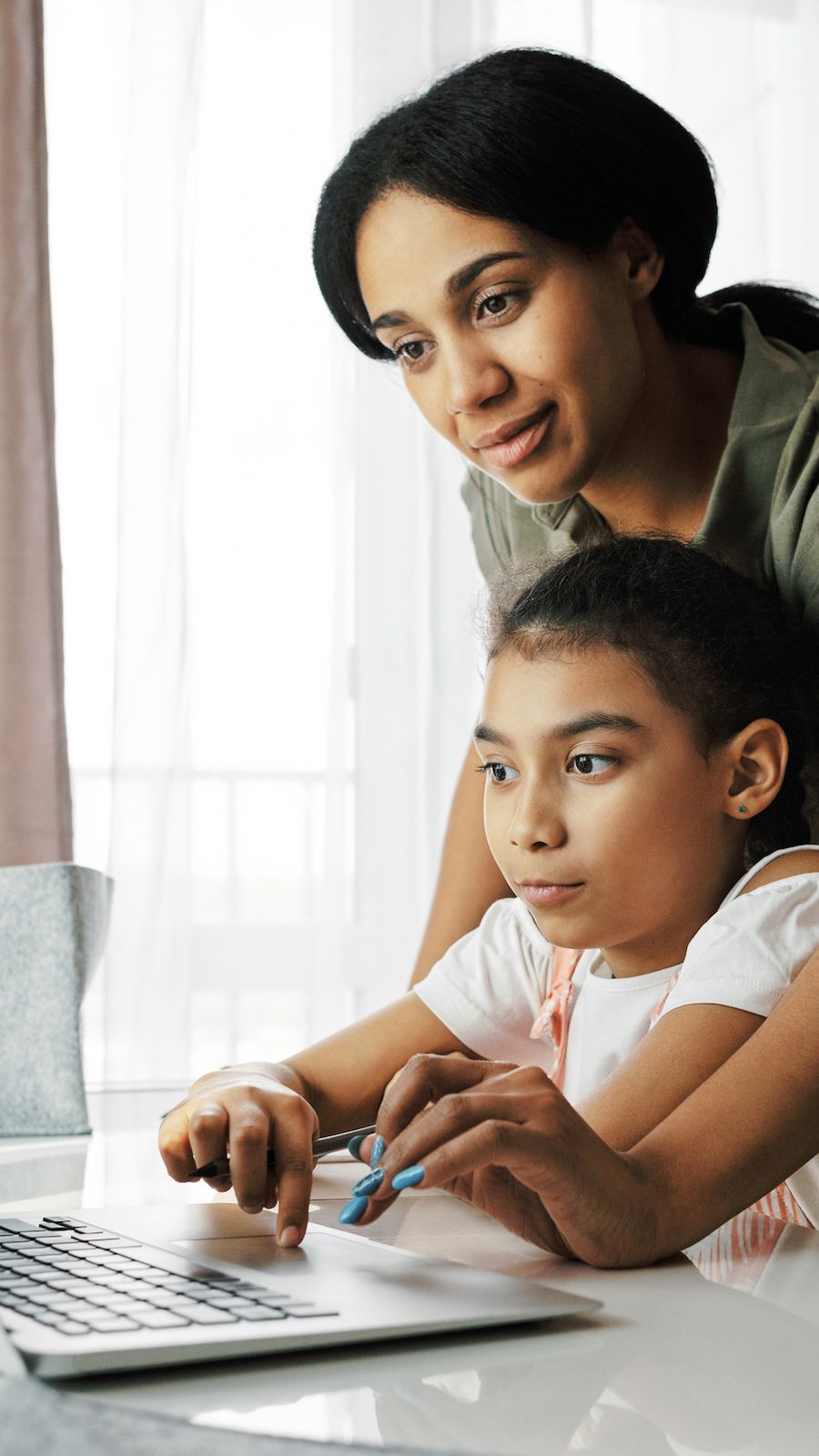 Teacher helping student
